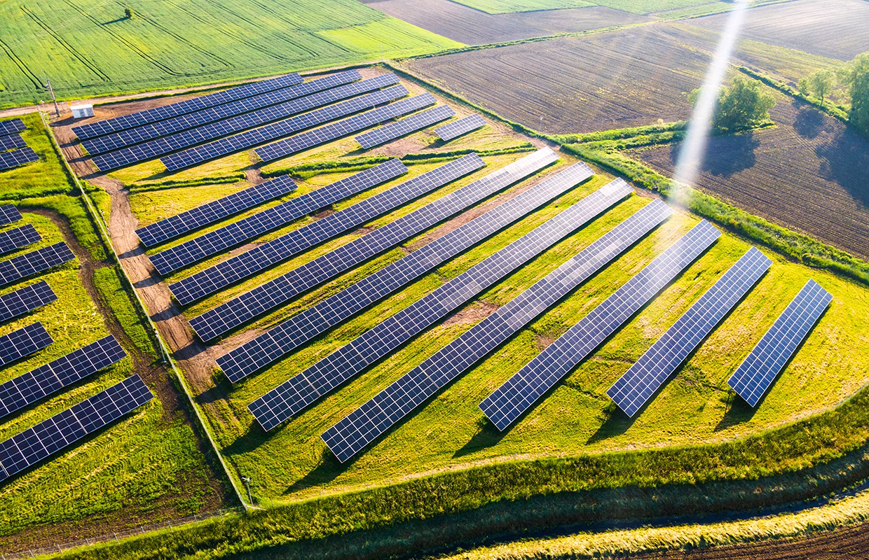 Solar Energy Farm in Fields. Aerial Drone View